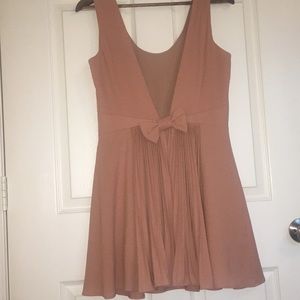 Dramatic back with a bow dress